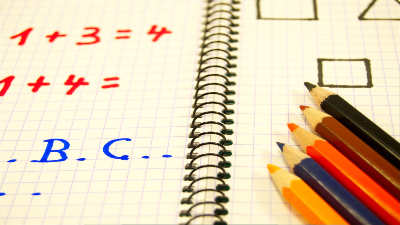 Worked fraction multiplication notes beside a simple calculator