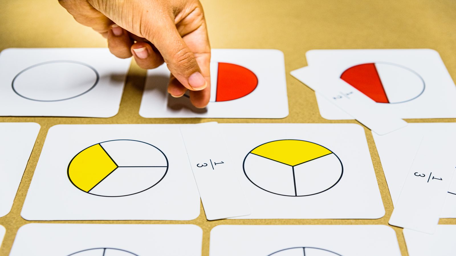 Ratio containing fractions being simplified step by step on paper